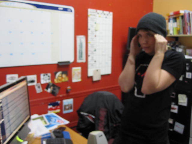 Photo of person wearing hat in an office setting.