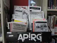 Colour photo of APIRG pamphlet stand. 