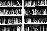 Black and white photo of bookshelf.