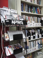 Photo of APIRG flyers and bookshelf. 