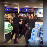 The bystander video filmed by Joshua Powell, showing the officers rushing to pin Sauter to the floor and block Powell's line of sight as he attempts to film